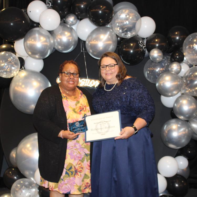  Two women in front of balloons