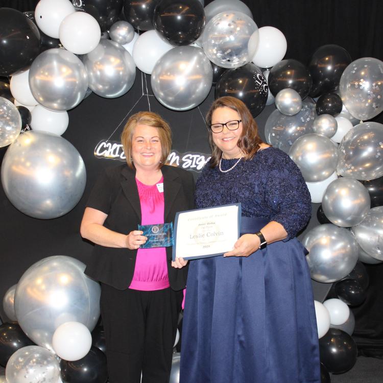  Two women in front of balloons
